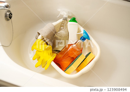 Home bathroom toilet cleaning concept. Bottles of cleaning products, sponges and rubber gloves. 123908494