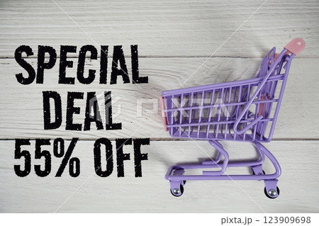 Special Deal 55% off and trolley shopping cart on wooden background 123909698