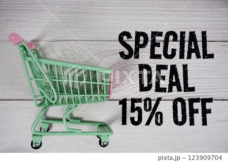 Special Deal 15% off and trolley shopping cart on wooden background Special Deal 15% off and trolley shopping cart on wooden background 123909704