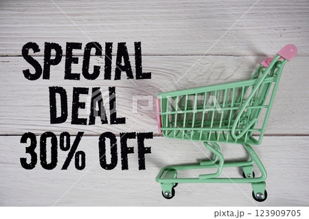 Special Deal 30% off and trolley shopping cart on wooden background Special Deal 30% off and trolley shopping cart on wooden background 123909705