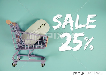 Sale 25% Special Discount shopping online with trolley shopping cart and optical mouse on blue background 123909715