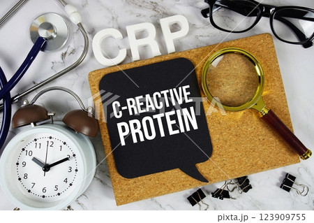 CRP C-Reactive Protein acronym with stethoscope, alarm clock and magnifying glass, medical and healthcare concept background 123909755
