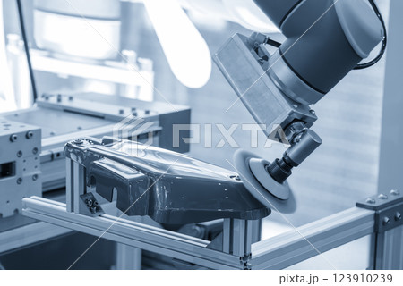The automotive parts polishing process by robotic system in the light blue scene. The automotive parts polishing process by robotic system in the light blue scene. 123910239