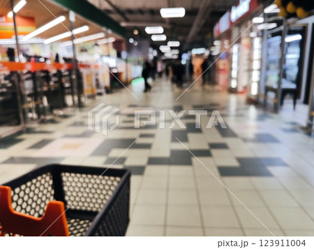Abstract blurred photo of store with trolley in department store bokeh background. Blurred supermarket, shopping concept Abstract blurred photo of store with trolley in department store bokeh background. Blurred supermarket, shopping concept 123911004