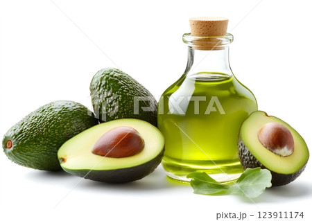 Fresh avocados and a bottle of avocado oil on white background Fresh avocados and a bottle of avocado oil on white background 123911174