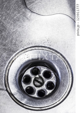 Drain hole in the kitchen sink Drain hole in the kitchen sink 123911777