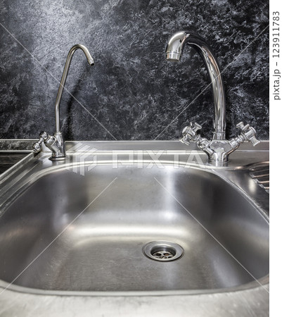 Kitchen faucet and sink close up 123911783