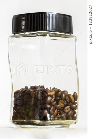 Jar with coffee grains Jar with coffee grains 123912027