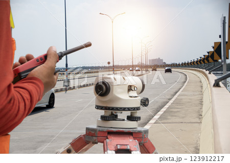 Engineers are using street level cameras. 123912217