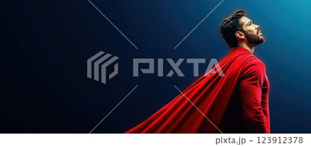 Superhero in Red Cape Against Dark Blue Background 123912378