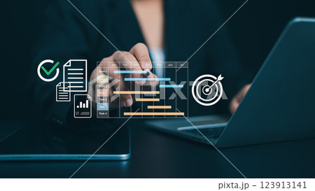 Project management tool and work schedule concept, Planning software, Businessman use laptop to manager working projects and update task with gantt chart schedule to business plan and progress. Project management tool and work schedule concept, Planning software, Businessman use laptop to manager working projects and update task with gantt chart schedule to business plan and progress. 123913141