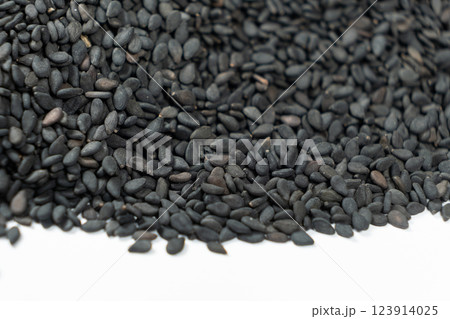 Black organic sesame seeds close-up on white background Black organic sesame seeds close-up on white background 123914025