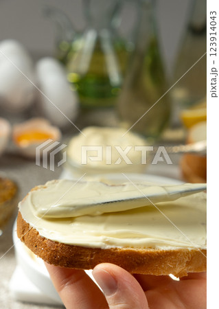 Thick Mayonnaise Spread on Bread Close-Up View Thick Mayonnaise Spread on Bread Close-Up View 123914043