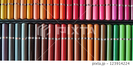 A large set of colored pencils. 123914224