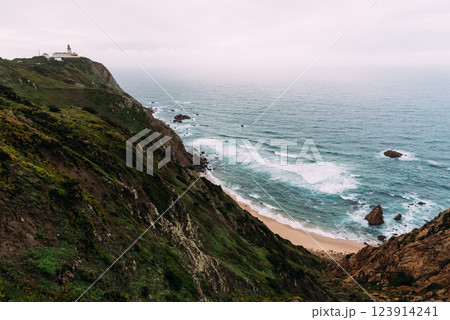 Aroeira Beach. Dramatic cliffs meet the Atlantic Ocean at Cape Roca, the westernmost point of Europe. Aroeira Beach. Dramatic cliffs meet the Atlantic Ocean at Cape Roca, the westernmost point of Europe. 123914241