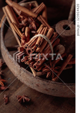 Cinnamon sticks, anise, and nutmeg on a wooden table. 123914420