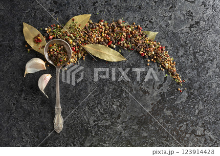 Mix of organic dried spices on a black stone background. Mix of organic dried spices on a black stone background. 123914428