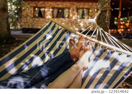 A young married couple is relaxing in the backyard of the house 123914642