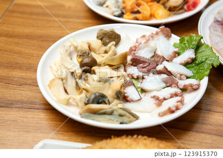 Korean seafood dish. Boiled conch and octopus sashimi Korean seafood dish. Boiled conch and octopus sashimi 123915370