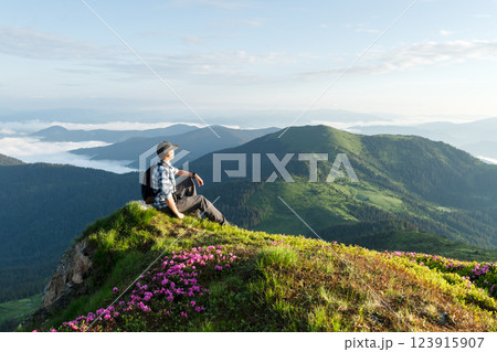 Scenic mountain landscape with a tourist Scenic mountain landscape with a tourist 123915907
