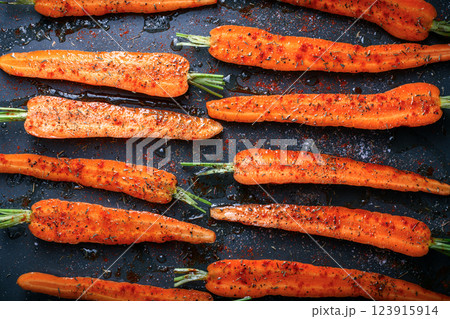 Top view of prepared carrots for baking in the baking oven Top view of prepared carrots for baking in the baking oven 123915914