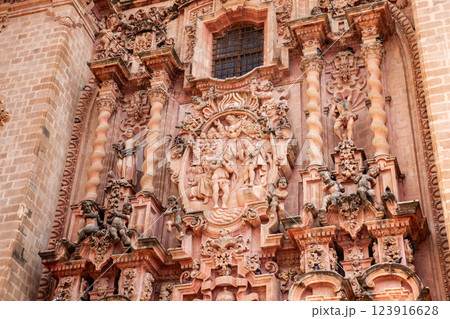 Detail of the facade of the beautiful historic Church of Santa Prisca built between 1751 and 1759 located on the east side of the main plaza of Taxco de Alarcon. 123916628