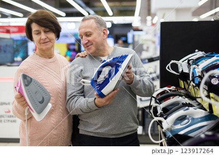 European spouses of mature age choose an iron 123917264