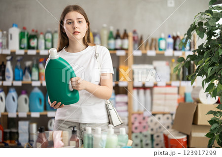 Woman consumer with household chemical products for washing indoors 123917299