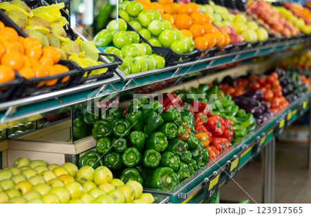 Stand with variety of vegetables and fruits in supermarket 123917565