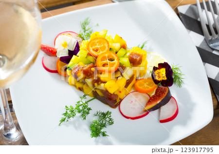 Tasty tuna tartare with mango and avocado, served with fig and flower Tasty tuna tartare with mango and avocado, served with fig and flower 123917795