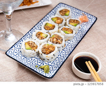 Sake Cooked Roll with fried salmon, avocado, and fried onion 123917858