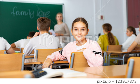 Portrait of schoolgirl at lesson in school Portrait of schoolgirl at lesson in school 123917875