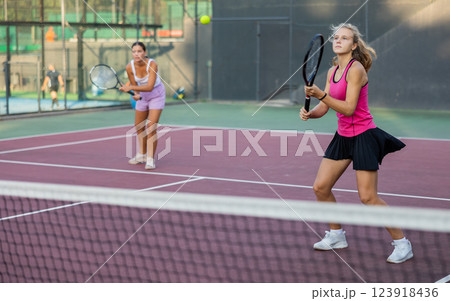 Portrait of emotional woman tennis player during friendly doubles couple match Portrait of emotional woman tennis player during friendly doubles couple match 123918436