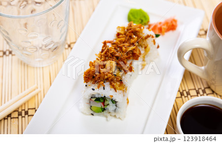 Curry roll - rolls with avocado, crab, cucumber and fried onion. Japanese traditional food Curry roll - rolls with avocado, crab, cucumber and fried onion. Japanese traditional food 123918464