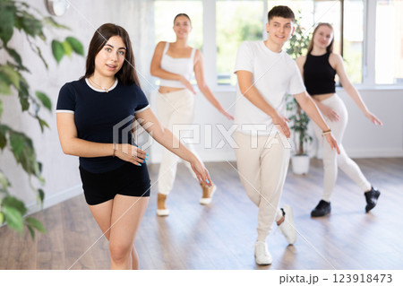 Group of young women and young guy dance contemporary 123918473