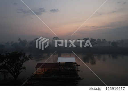 Tranquil morning by the river with mist over water and trees Tranquil morning by the river with mist over water and trees 123919657