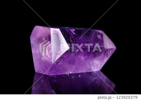 Macro mineral stone Amethyst crystal on a black background Macro mineral stone Amethyst crystal on a black background 123920379