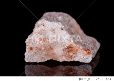 Macro mineral stone red gypsum on black background 123920383