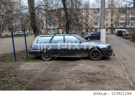 An old silver car.An old car is parked in the yard, attracting attention due to its survivability. 123921294