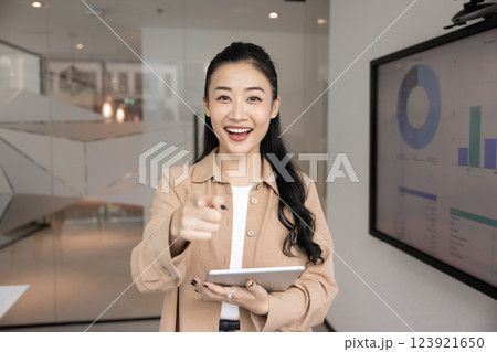 Cheerful young Asian recruit manager woman pointing finger at camera 123921650