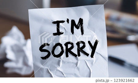 An apology note, handwritten, with smudged ink and torn paper Understanding of Forgiveness and Regret 123921662