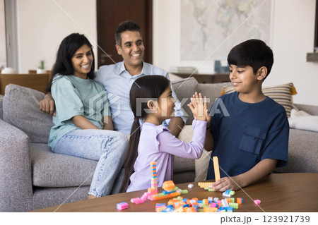 Children play together, give high five, start or finish game Children play together, give high five, start or finish game 123921739