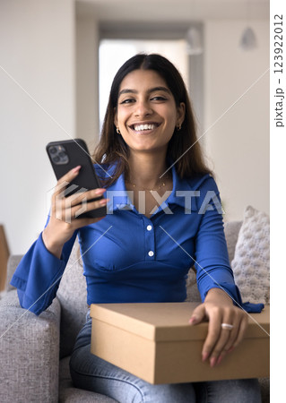 Happy e-commerce client writing positive feedback for received goods 123922012