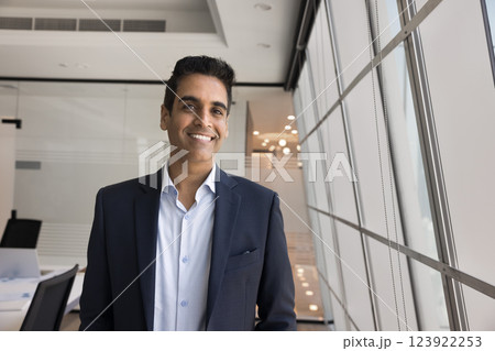 Happy mature business leader posing in office looking at camera 123922253
