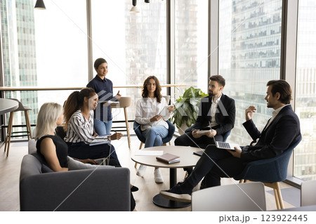 Young professionals staff members talking met in office 123922445
