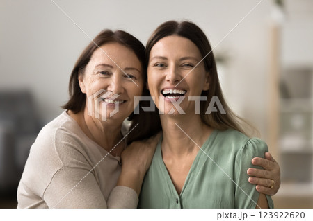 Close up portrait of happy elderly woman and her daughter Close up portrait of happy elderly woman and her daughter 123922620