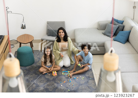 Portrait of kids and loving mother spend playtime at home Portrait of kids and loving mother spend playtime at home 123923267