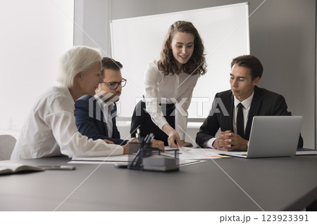 Female coach train diverse managers give paper documents in work 123923391