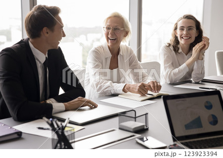 Laughing diverse corporate workers having fun on discussion at boardroom 123923394