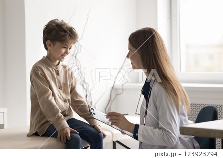 Happy little child patient on meeting with smiling female doctor 123923794